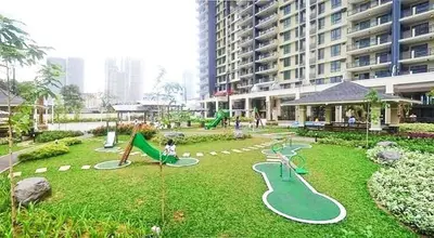 a playground in a building with a park with slides at Flair Towers Urban Resort Staycations in Manila