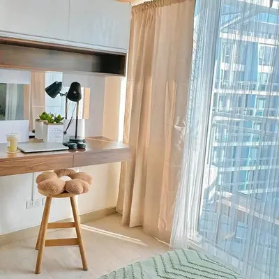 a desk with a stool in a room with a window at Rio West Tower - Azure Urban Resort Residences in Manila