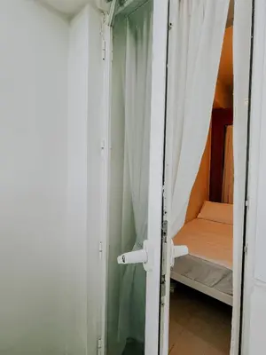 a door to a room with a bed in it at 2Br Cozy Unit near Manila International Airport in Manila