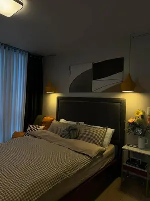a bedroom with a large bed with at SerenityPads in Manila