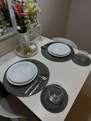 a table with plates and utensils on top of it at SerenityPads in Manila