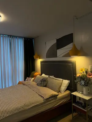 a bedroom with a bed and a window at Serenity Pads in Manila