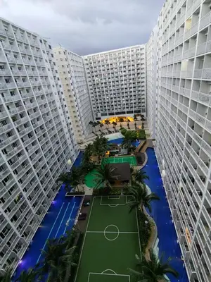 an aerial view of two large buildings with a tennis court at Mk Luxury Staycation in Manila
