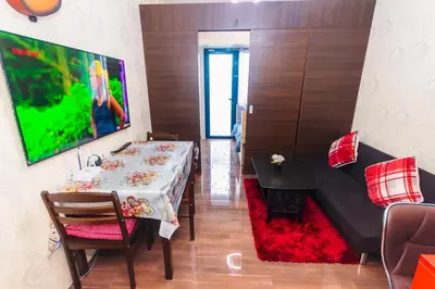 a living room with a table and a couch at Eccentric Escape Stylish Makati Urban Swim Gym 4034 in Manila