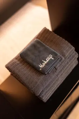 a wallet sitting on top of a table at Tranquil Greenbelt Makati Condo - Free Pool Access in Manila