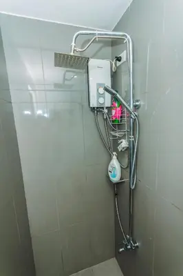 a shower in a bathroom with a shower at City Chill Spot Where Style Meets Smiles Swim Gym Park 1765 in Manila