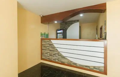 a bar with a stone wall and a mirror at Ranchotel General Trias Cavite by RedDoorz in Uldugan