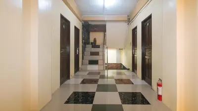 a hallway of a building with a checkered floor at Ranchotel General Trias Cavite by RedDoorz in Uldugan