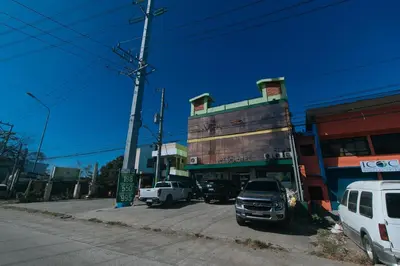 a truck parked in a parking lot next to a building at Ranchotel General Trias Cavite by RedDoorz in Uldugan