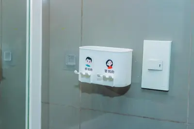 a white object on a wall in an elevator at Boutique Air Retreat Relax Laugh Swim Gym Car Park 1767 in Manila