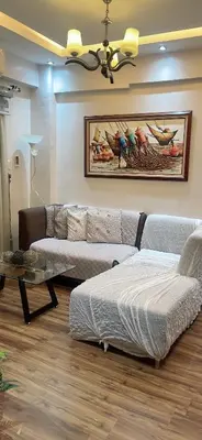 a living room with a couch and a table at Resorts world condotel High speed wifi in Manila
