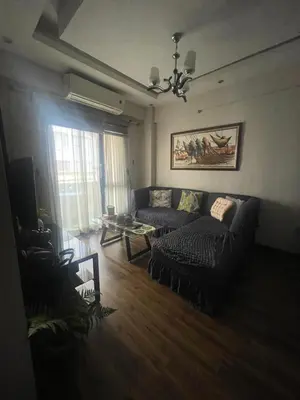 a living room with a couch and a table at Resorts world condotel High speed wifi in Manila