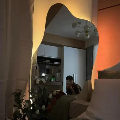 a man sitting on a couch in a living room at Serene Cove Azure in Manila