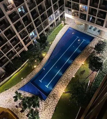 an overhead view of a swimming pool in a building at ren&ayesha place in Manila
