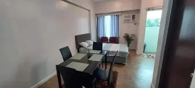 a living room with a table and a couch at Kaireese Properties in Manila