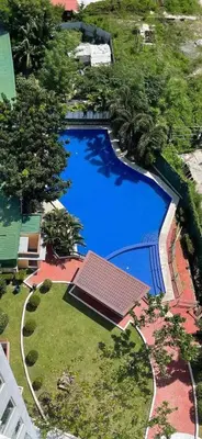 an overhead view of a large blue swimming pool at Kaireese Properties in Manila