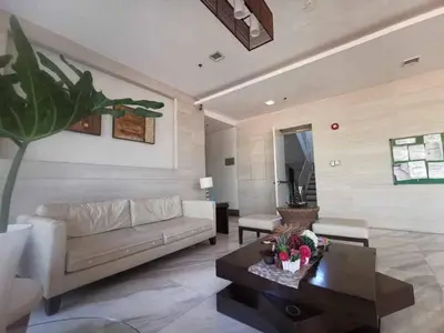 a living room with a couch and a coffee table at Kaireese Properties in Manila