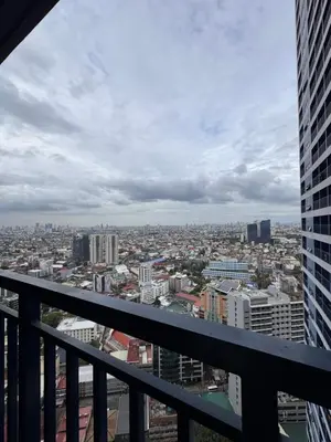 a view of a city from the balcony of a building at The Air Residences #3724 in Manila