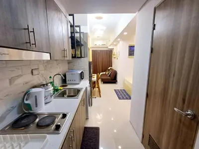 a small kitchen with a sink and a stove at My Staycation moa area S Residences tower1 in Manila