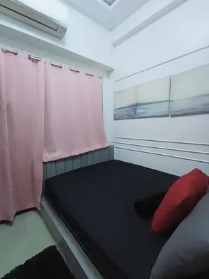 a small room with a bed and a window at Shore residence Tower D moa ecom view cozy bedroom in Manila