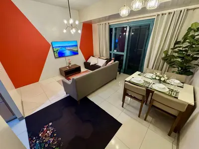 an overhead view of a living room with a couch and a table at BGC One Uptown 2bedroom with balcony and 1 free parking in Manila