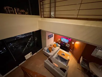 an overhead view of a living room with couches and a tv at Gramercy Residences Spacious 1 BR Loft FREE Amenities in Manila