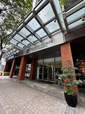 a building with a potted plant in front of it at Business Studio in Salcedo Village Makati in Manila