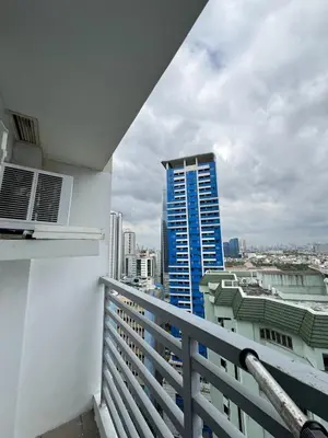 a balcony with a view of a city at Business Studio in Salcedo Village Makati in Manila