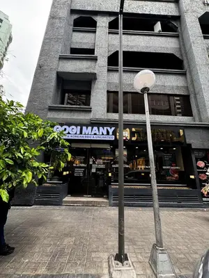 a street light in front of a building at Business Studio in Salcedo Village Makati in Manila