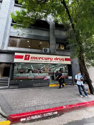two people walking in front of a memory chips store at Business Studio in Salcedo Village Makati in Manila