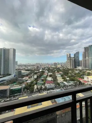 a view of a city from the balcony of a building at Grand Soho Makati Condo in Manila