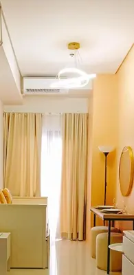 a living room with a window and a table at Happystaywithus in Manila
