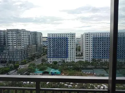 a view of a city with tall buildings at Happystaywithus in Manila