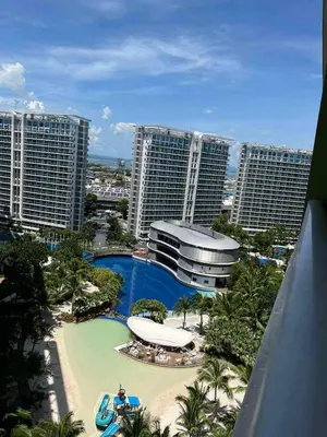 a view of a resort with a pool and buildings at Azure's Best by Condo Suites PH in Manila