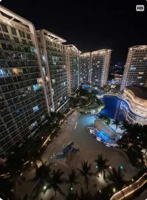 an aerial view of a resort at night at Azure's Best by Condo Suites PH in Manila