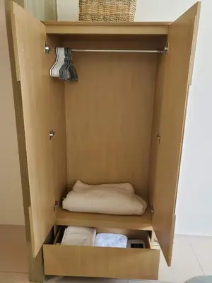 a cupboard with a bed and towels in it at Barkada Room by Metro Staycation in Manila