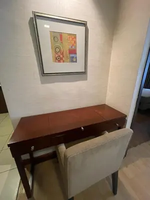 a desk and a chair in a room at A venue Residences Tower 10i in Manila