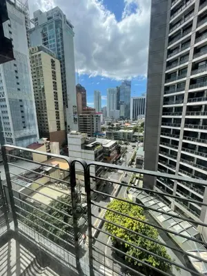 a view of a city from the balcony of a building at A venue Residences Tower 10i in Manila
