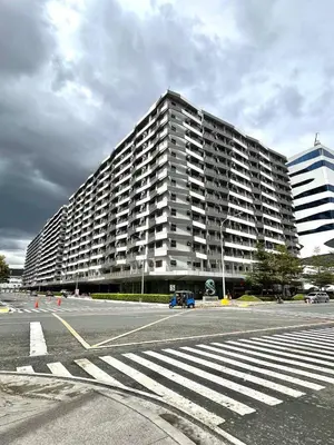 a large apartment building on a street with a parking lot at Sonens Hem S Residences in Manila