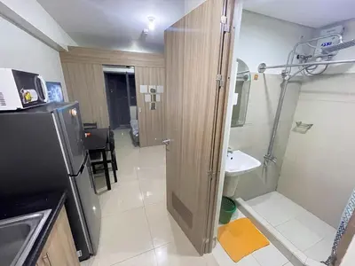 a small bathroom with a shower and a sink at shore 2 tower 3 4 floor in Manila