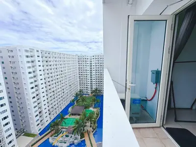 a view from the balcony of a building at Shore 1 tower c1 17floor near moa facing swimming pool in Manila