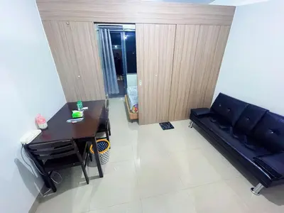 a living room with a couch and a table at shore 2 tower 1 19 floor in Manila