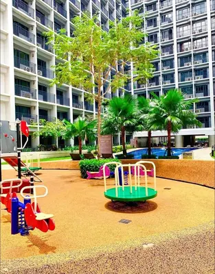 a playground in front of a large building at shore 2 tower 1 19 floor in Manila