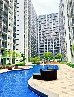 a swimming pool in a city with tall buildings at shore 2 tower 1 19 floor in Manila
