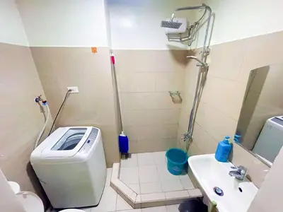 a small bathroom with a toilet and a sink at shore 2 tower 2 4 floor in Manila