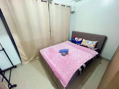 a small bed with a stuffed animal sitting on it at shore 2 tower 2 3 floor in Manila