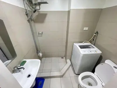 a small bathroom with a toilet and a sink at shore 2 tower 2 3 floor in Manila