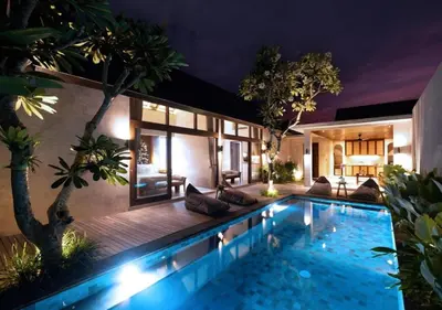a house with a swimming pool at night at warda private villa in Pasong Bayog
