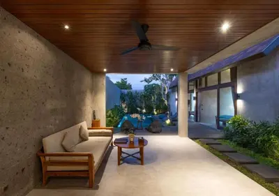 a living room with a couch and a ceiling fan at warda private villa in Pasong Bayog