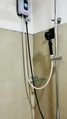 a camera on a wall in a room at Direct Access to pool Bedroom in Manila